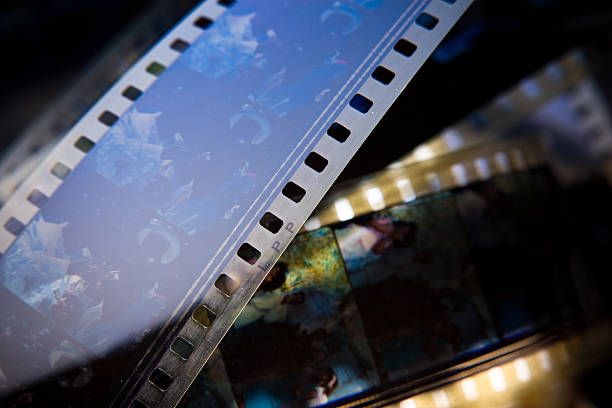 A close-up of overlapping strips of 35mm motion-picture film.