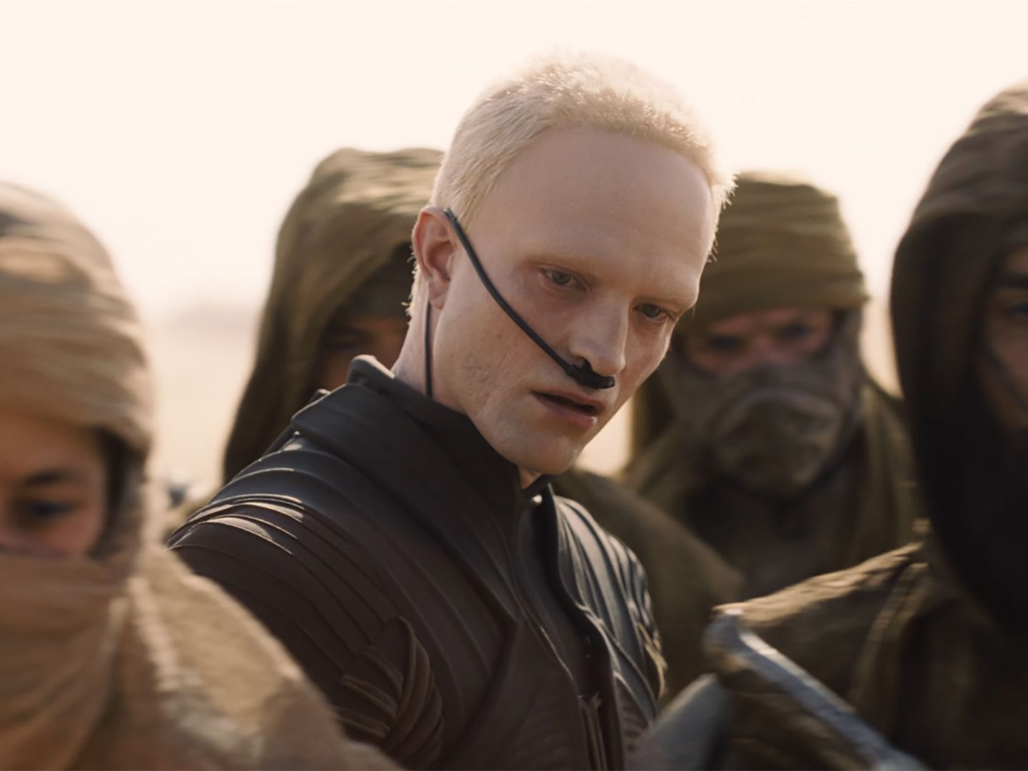Robert Pattinson appears with very pale skin and cropped blond hair as Scytale in Dune: Part Three.