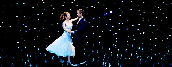 Mia and Sebastian dance together against a dark, star-filled background.