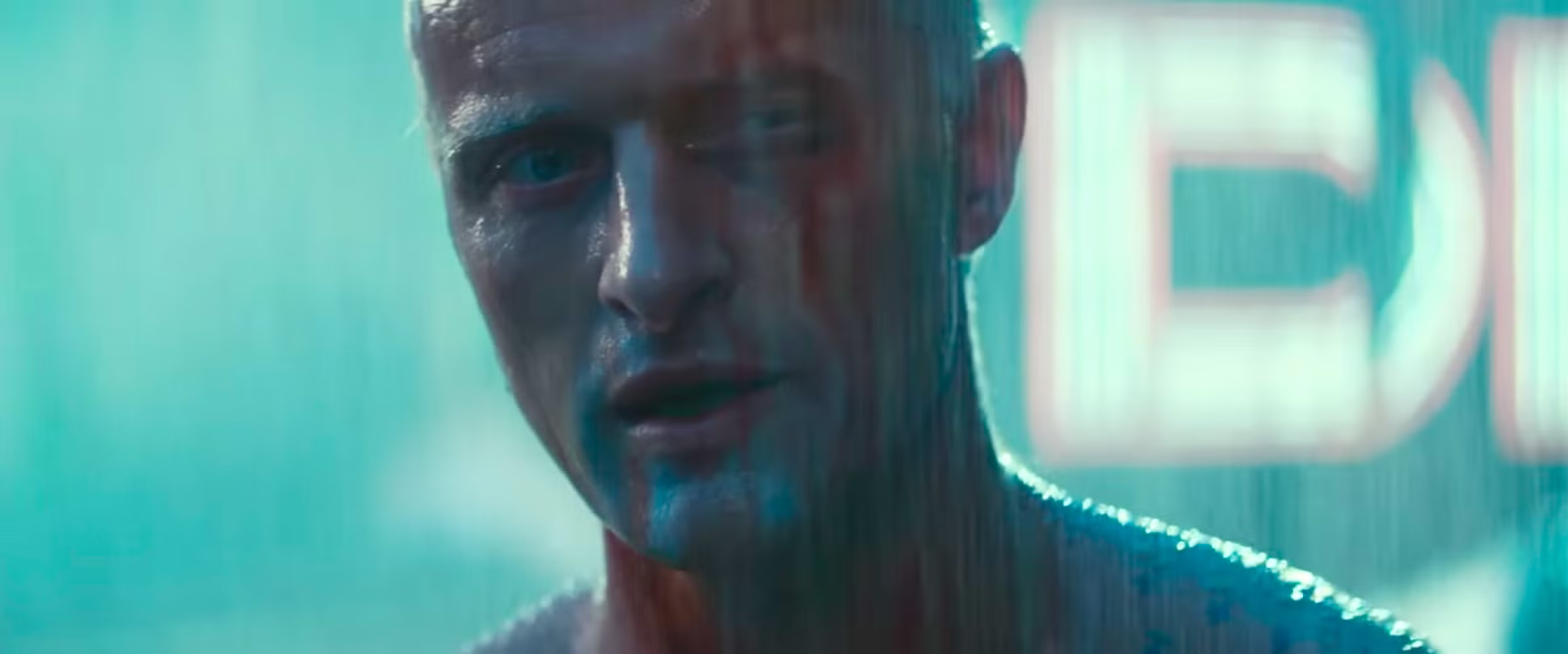 Roy Batty looks forward beneath cool artificial light in Blade Runner.
