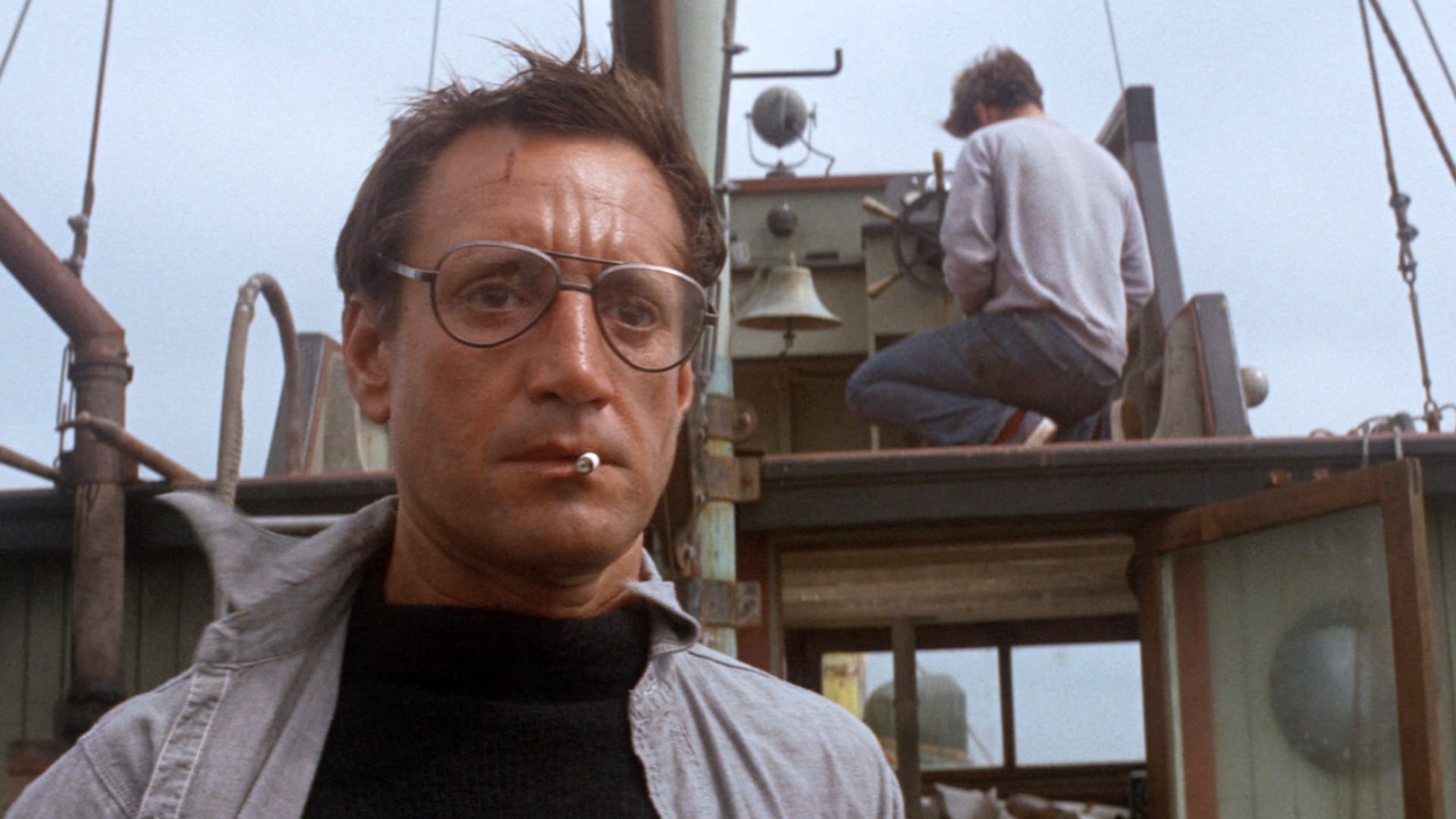 Chief Brody stands on a small boat at sea in Jaws.