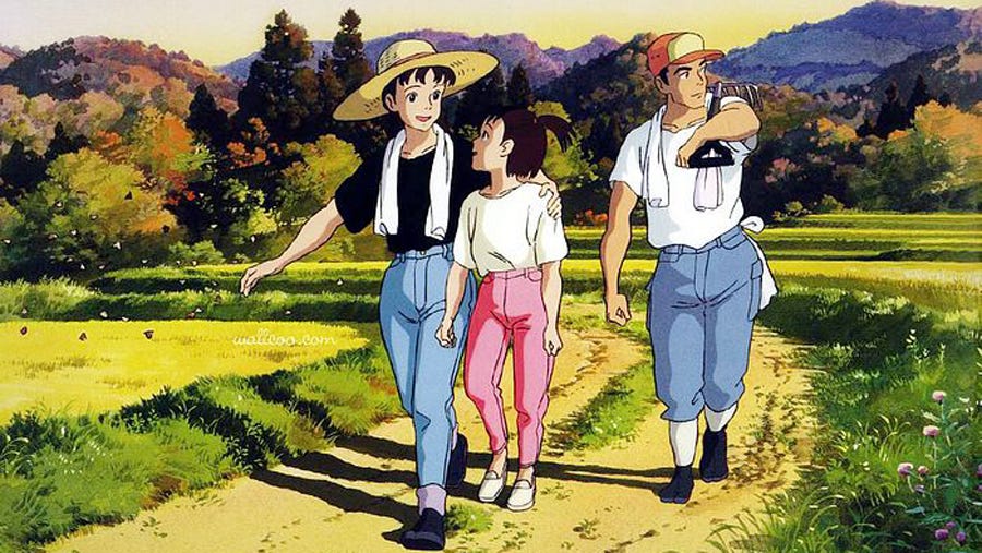 Three characters walk through a bright rural landscape in Studio Ghibli’s Only Yesterday.