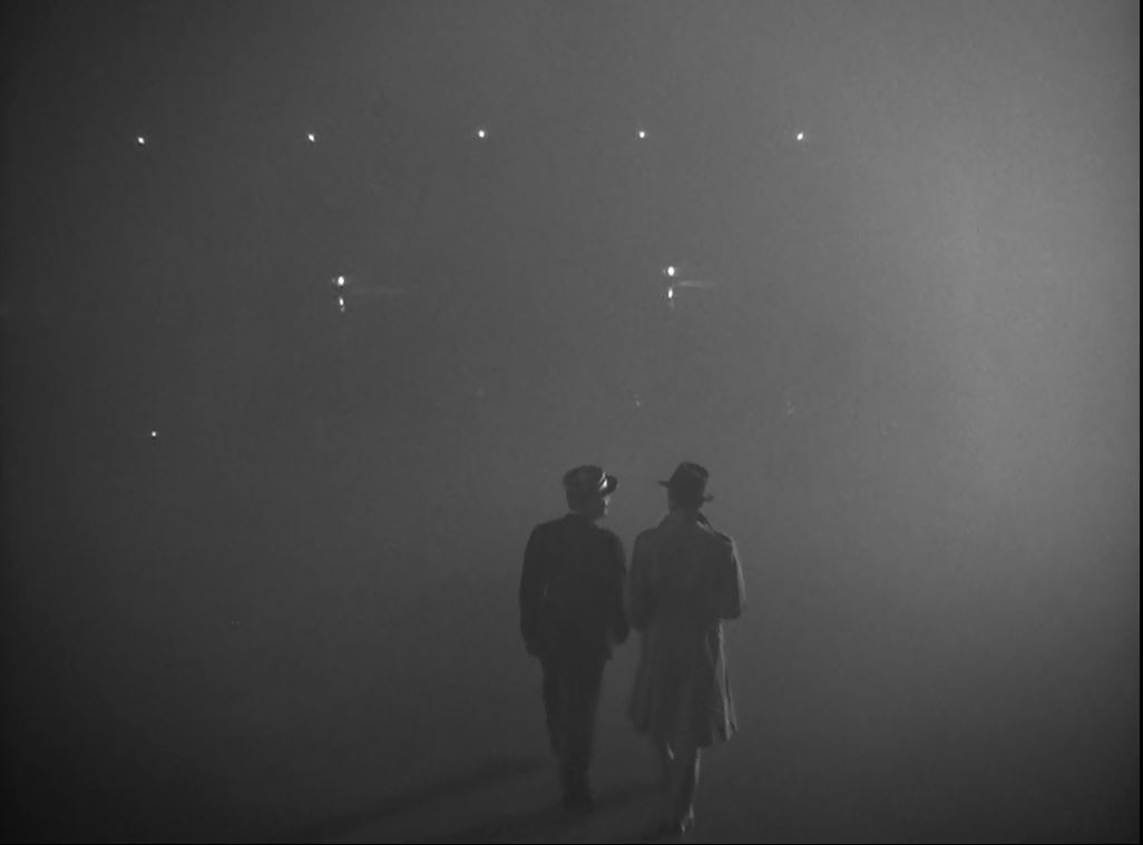 Two men walk away through heavy fog in the final scene of Casablanca.