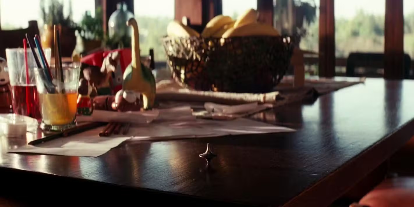 A spinning top sits on a table near the end of Inception.