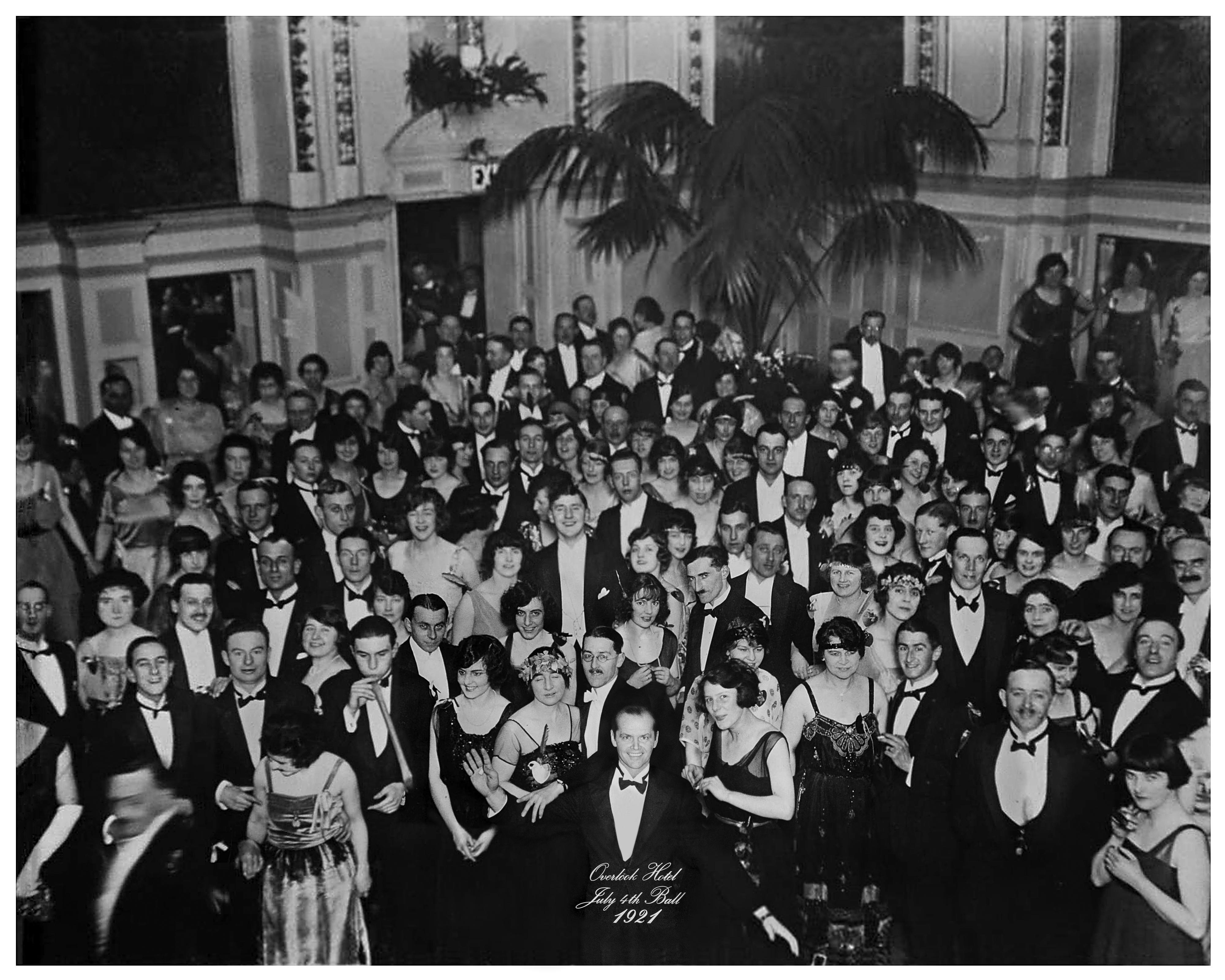 A large black-and-white ballroom photograph from the Overlook Hotel with Jack Torrance visible among the guests.