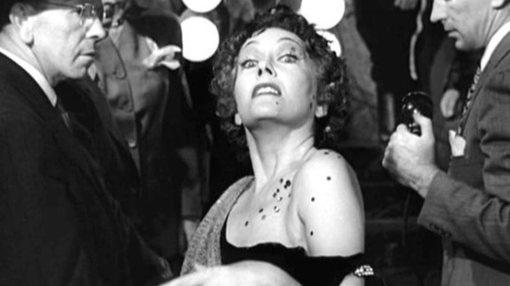 Norma Desmond looks upward toward cameras in the closing sequence of Sunset Boulevard.
