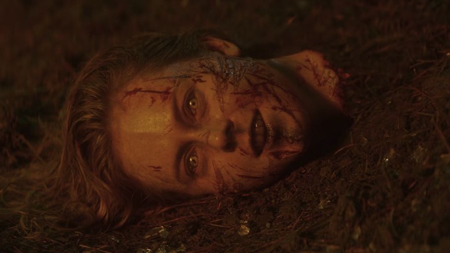 A possessed figure emerging from smoke in Evil Dead Burn