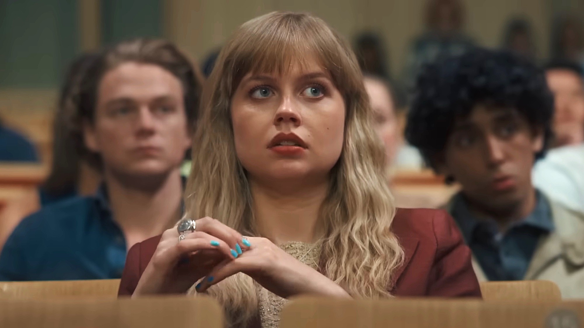 Angourie Rice sits in a university lecture hall in Finding Emily.