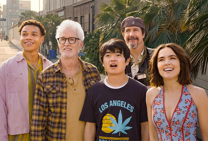 Zoey Deutch stands with Miles Gutierrez-Riley, John Slattery, Ben Wang and Ken Marino on a sunny Los Angeles street.