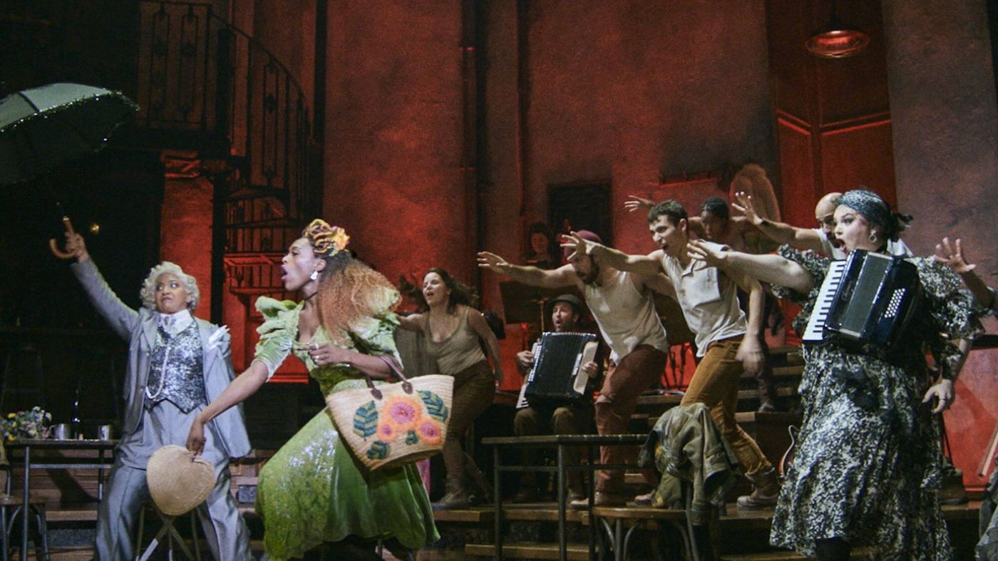 The Hadestown ensemble performing a workers' number