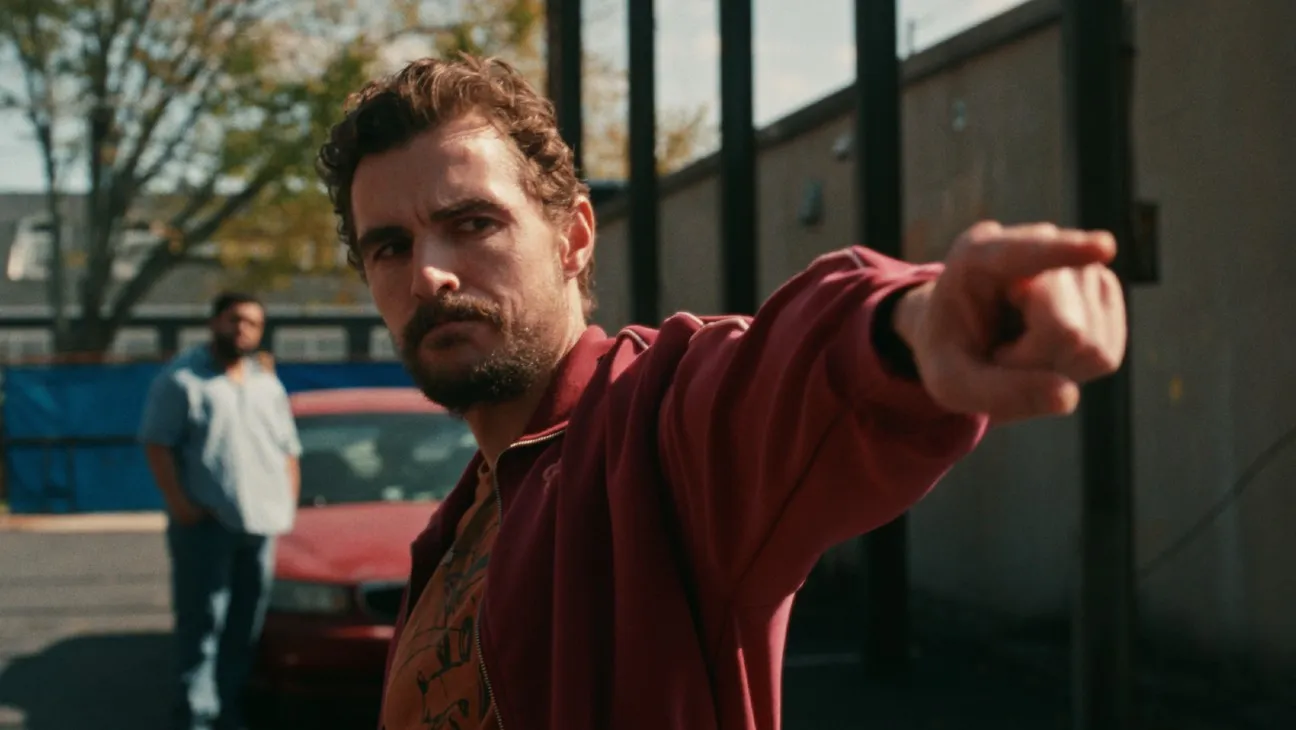 Dave Franco points aggressively outside while O’Shea Jackson Jr. stands behind him in Idiots.