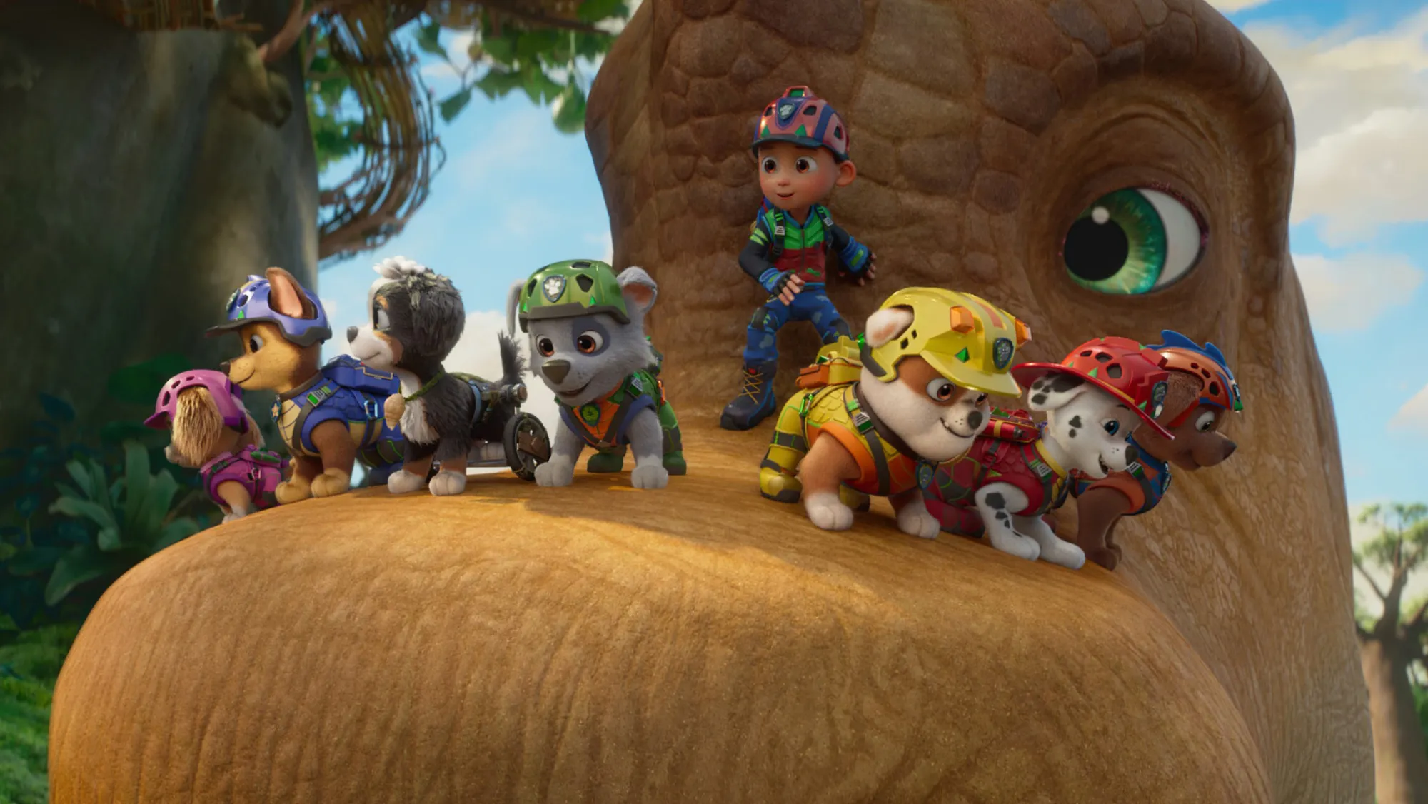 Several PAW Patrol characters stand on a large dinosaur in PAW Patrol: The Dino Movie.
