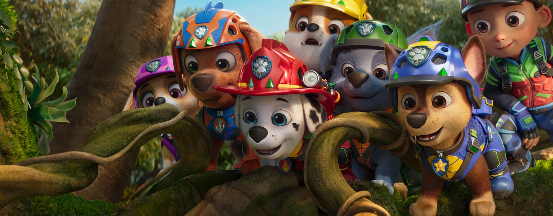 The PAW Patrol team gathers together among vines and greenery in PAW Patrol: The Dino Movie.