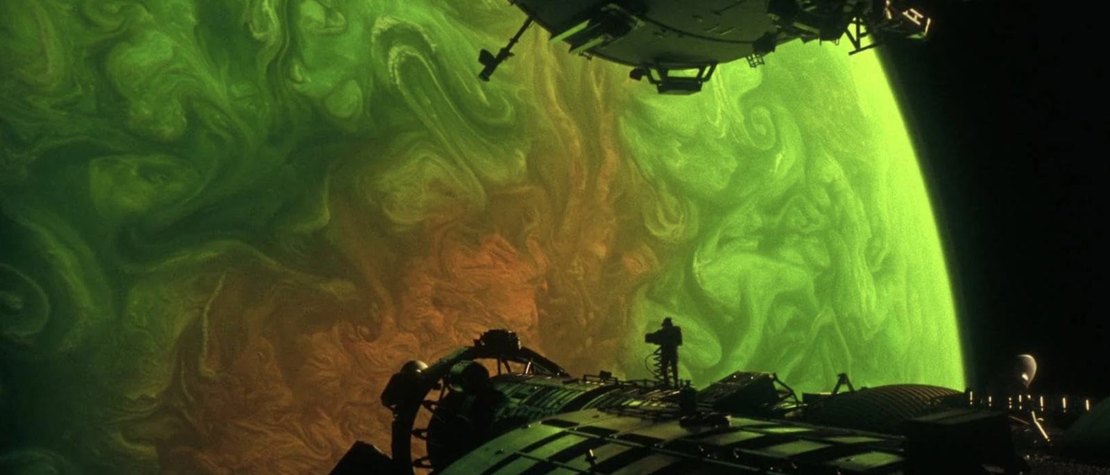 A crewmember on the hull of the Hail Mary against a swirling gas giant