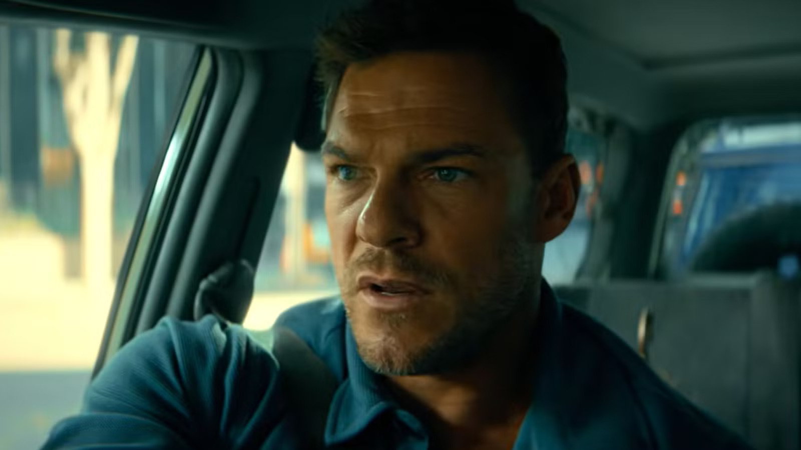 Alan Ritchson appears as courier Hank Malone in Runner.