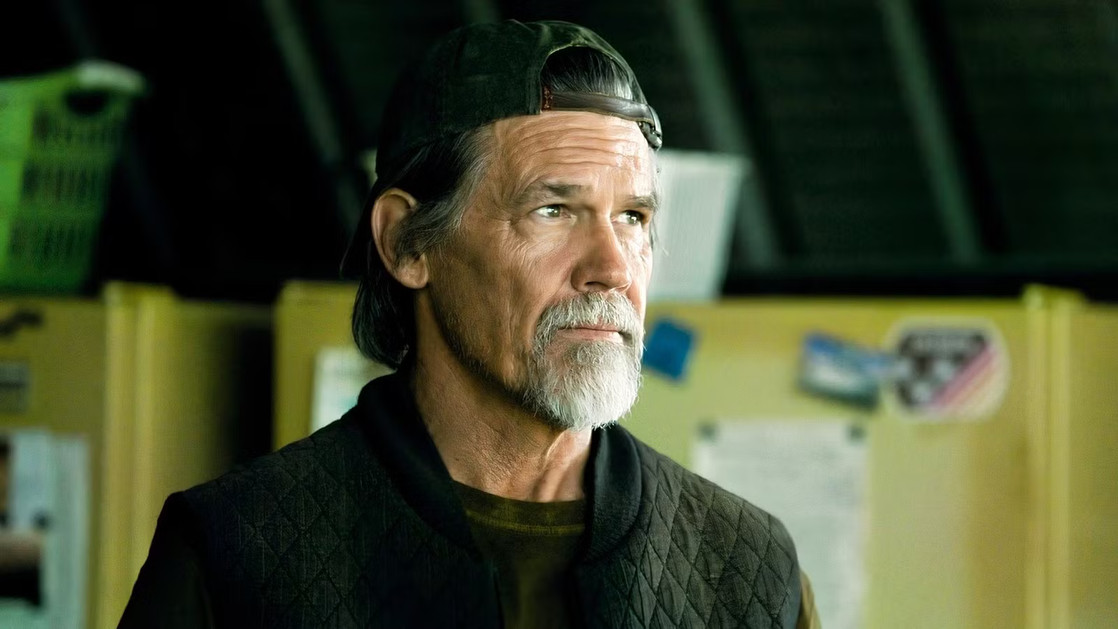 Josh Brolin stands inside an airfield building in The Dog Stars.