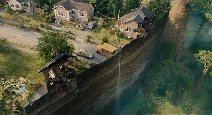 A suburban neighborhood appears dwarfed by a massive prehistoric landscape in The End of Oak Street.