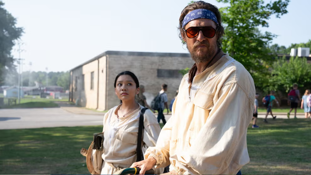 Angelina LookingGlass stands beside Matthew McConaughey outdoors in The Rivals of Amziah King.