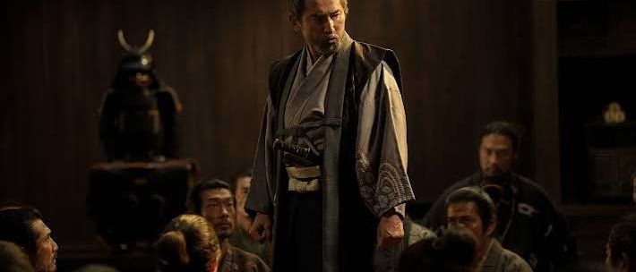 A samurai lord addressing a gathered court