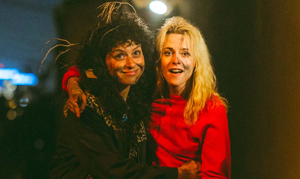 Alia Shawkat and Kristen Stewart smile with their arms around each other in The Wrong Girls.